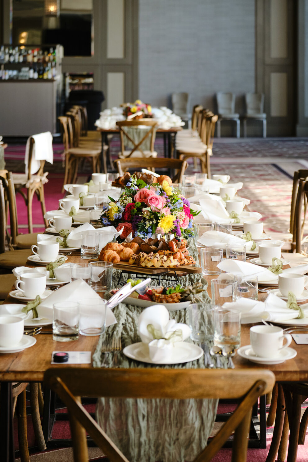 a long table with food and glasses
