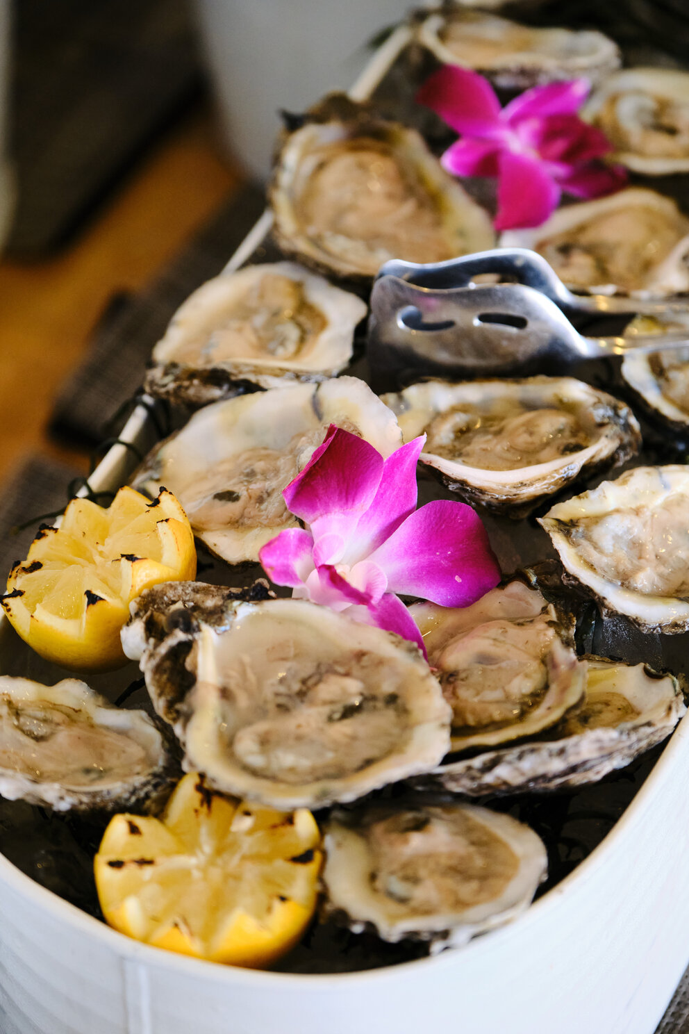 a plate of oysters and lemons